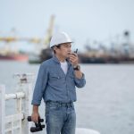 asian-engineer-man-using-walkie-talkie-binoculars-compare-with-real-locations-construction_38443-210